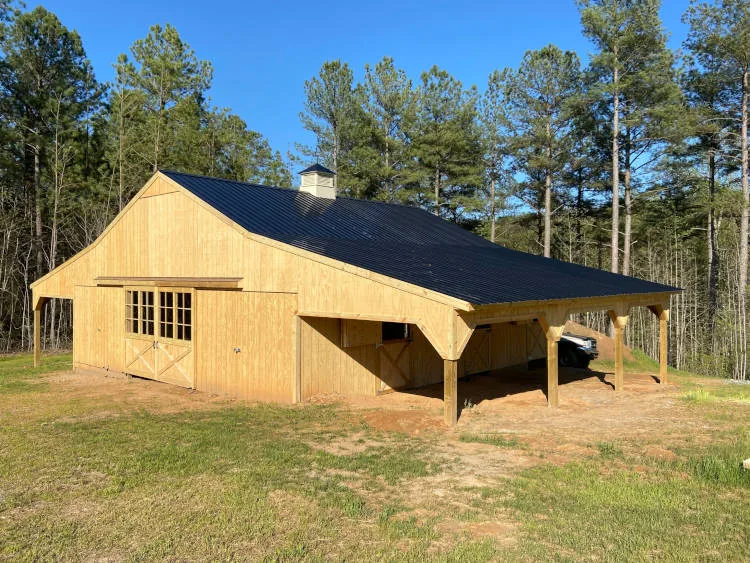 Custom barn with a covered lean-to